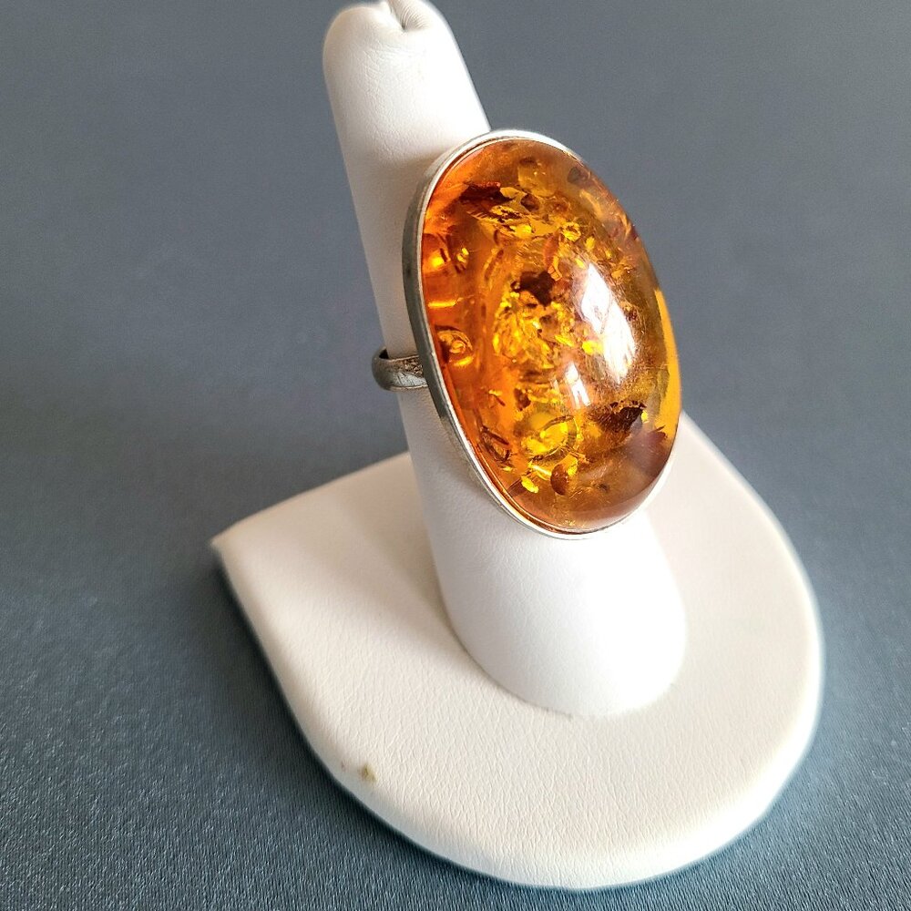 Large oversized sterling silver cocktail ring with oval Amber stone.